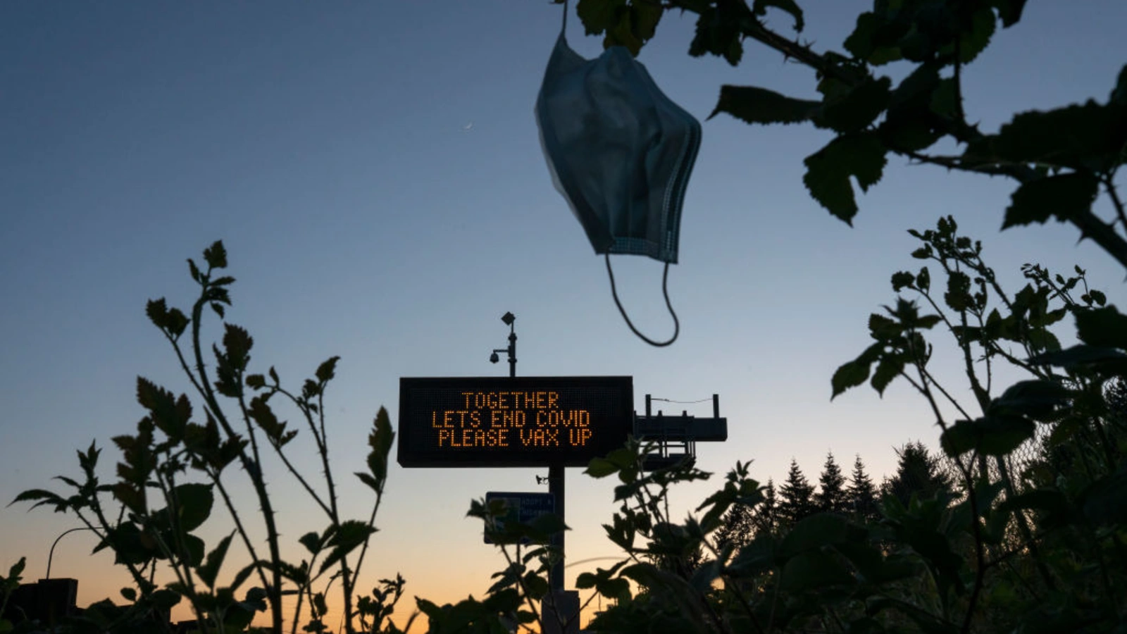 A highway sign promotes COVID-19 vaccination in May 2021 in Vancouver, Washington.